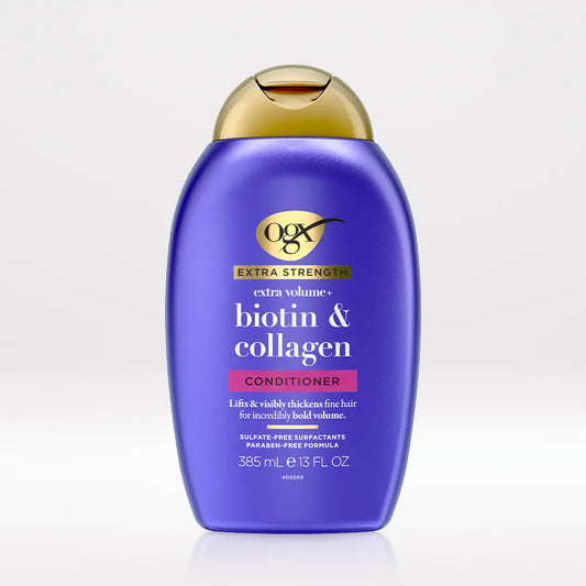 OGX Extra Strength Biotin and Collagen Volumizing Conditioner 13 oz bottle on light neutral background