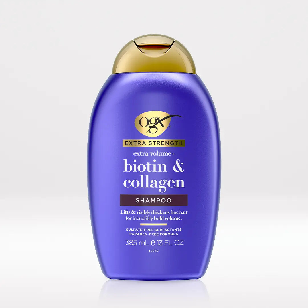 OGX Extra Strength Biotin and Collagen Volumizing Shampoo 13 oz bottle on light neutral background