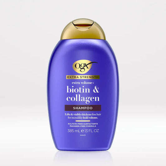 OGX Extra Strength Biotin and Collagen Volumizing Shampoo 13 oz bottle on light neutral background