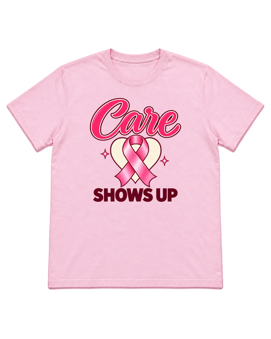 Digital mockup of Care Shows Up pink-ribbon design on a light-pink T-shirt