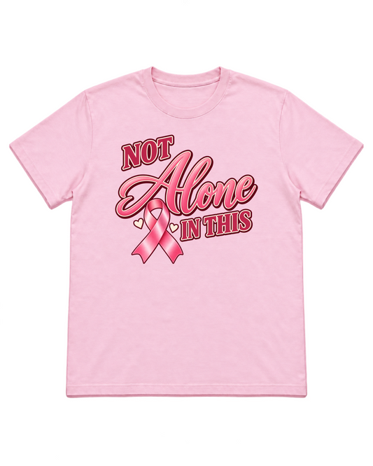 Digital mockup of Not Alone In This on a Light Pink Gildan 5000 shirt
